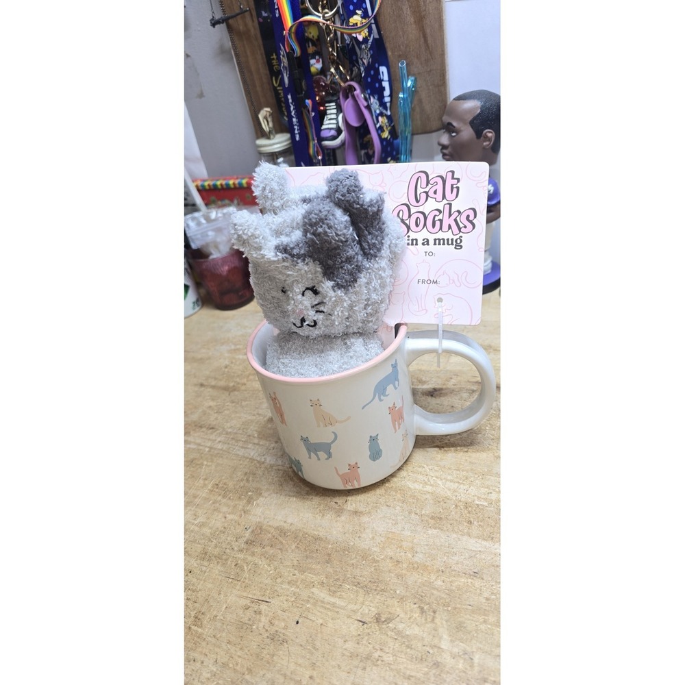 This Sunday Morning Ceramics cat-themed mug set includes fuzzy socks for women